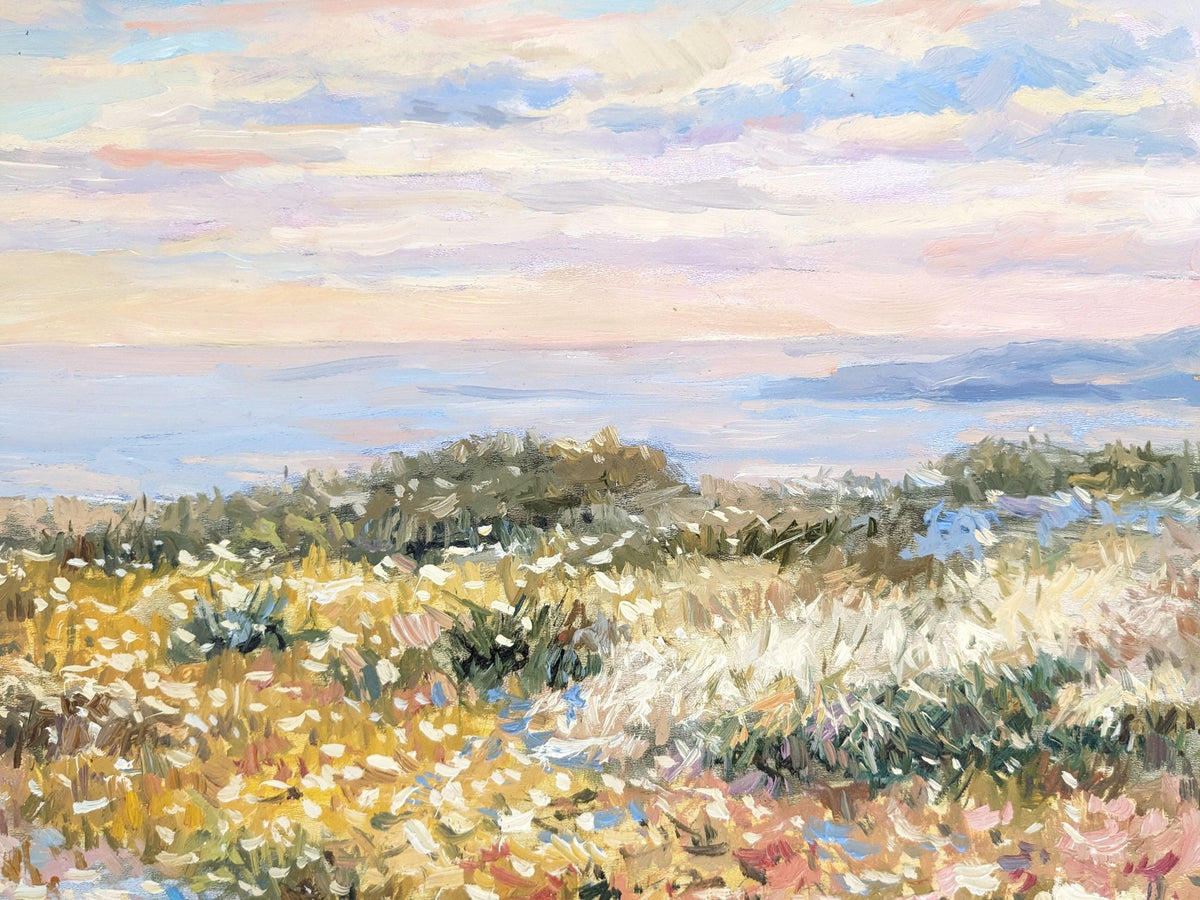 The image is an impressionist painting depicting a serene landscape with a field of flowers and a body of water in the background.