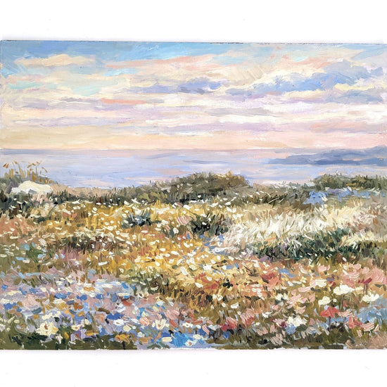 The image is an impressionist painting depicting a field of flowers with a body of water in the background.